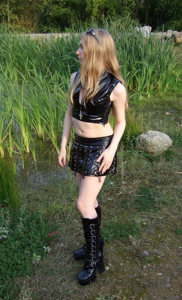 Blonde Gothic Girl with Bare Legs wearing Black Leather Miniskirt